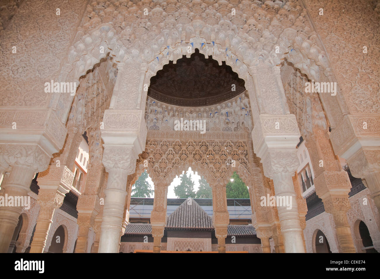 Palace Lions architectural pinnacle Alhambra Columns cubic capitals hanging spandrel work plasterwork adorn open courtyard Stock Photo