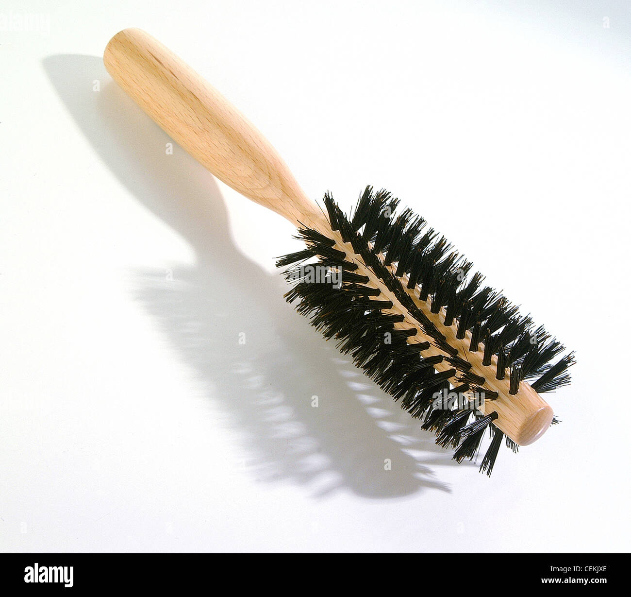 Round hair brush with wooden handle Stock Photo - Alamy