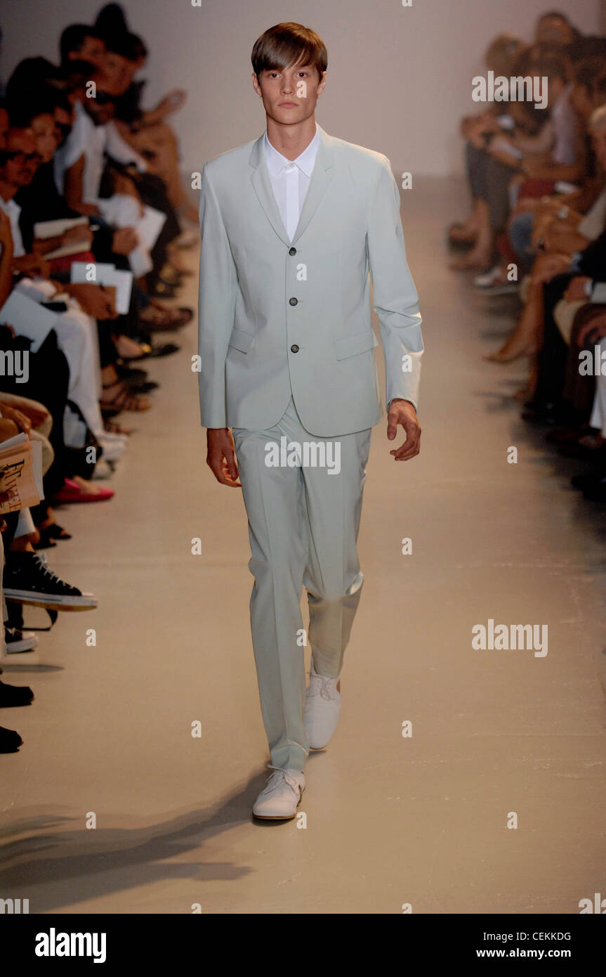 Jil Sander Milan Menswear Ready to Wear Spring Summer Model wearing very  pale blue suit white shirt and leather lace up shoes Stock Photo - Alamy