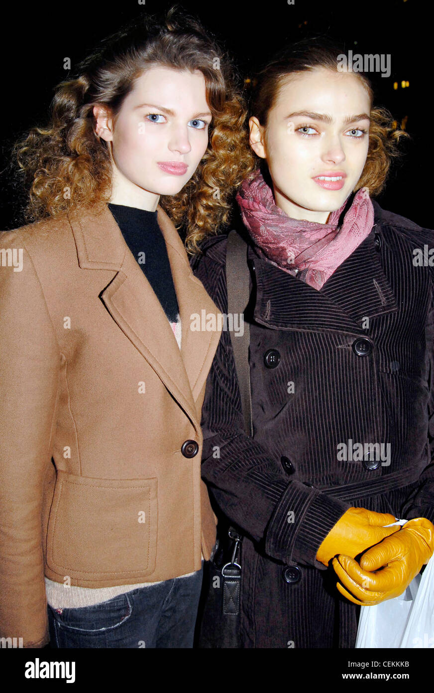 NEW YORK A W SHOWS MISCELLANY Brunette female models with curly hair  wearing jackets and gloves Stock Photo - Alamy