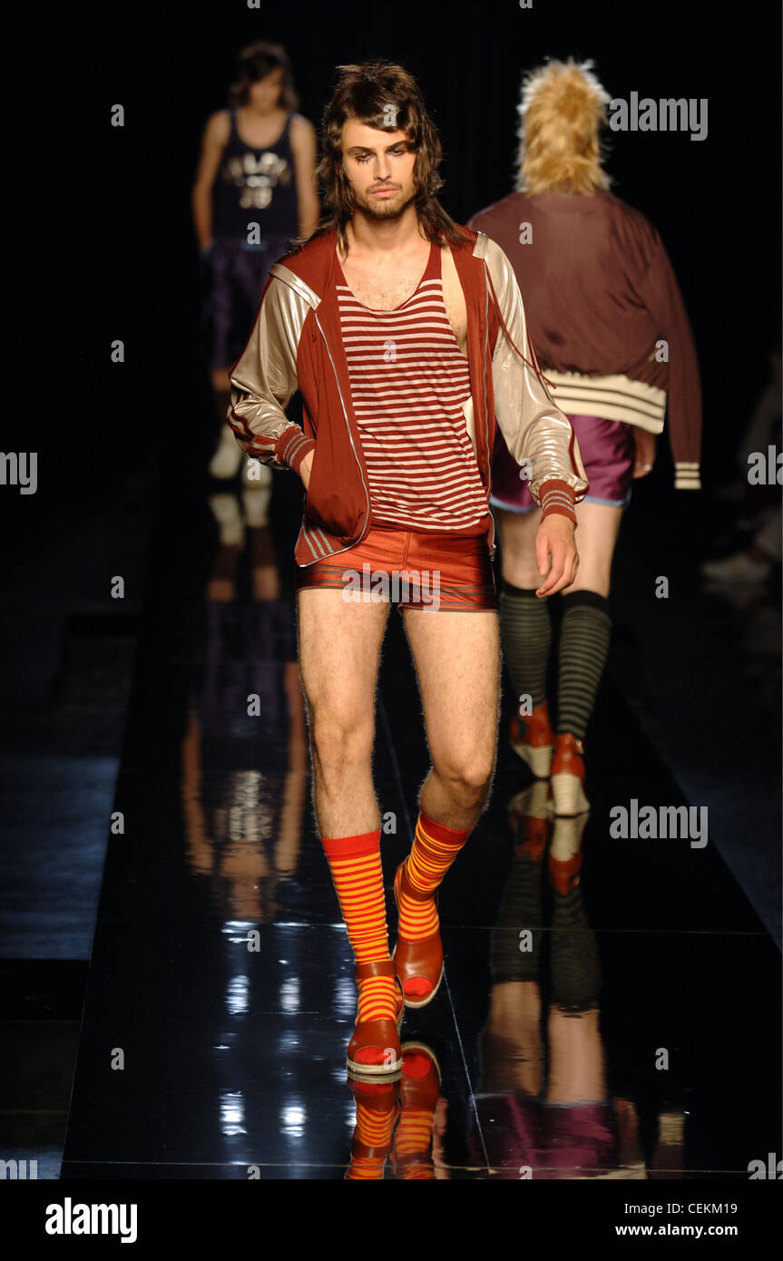 John Paul Gaultier Paris Ready to Wear Menswear Spring Summer Brunette male model wearing a red and white stripey vest, red Stock Photo
