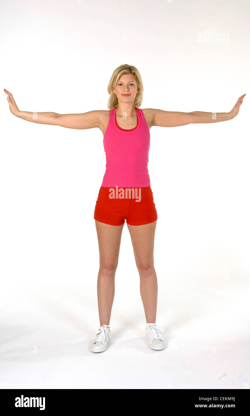 Female standing stretching arms out to side Stock Photo Alamy