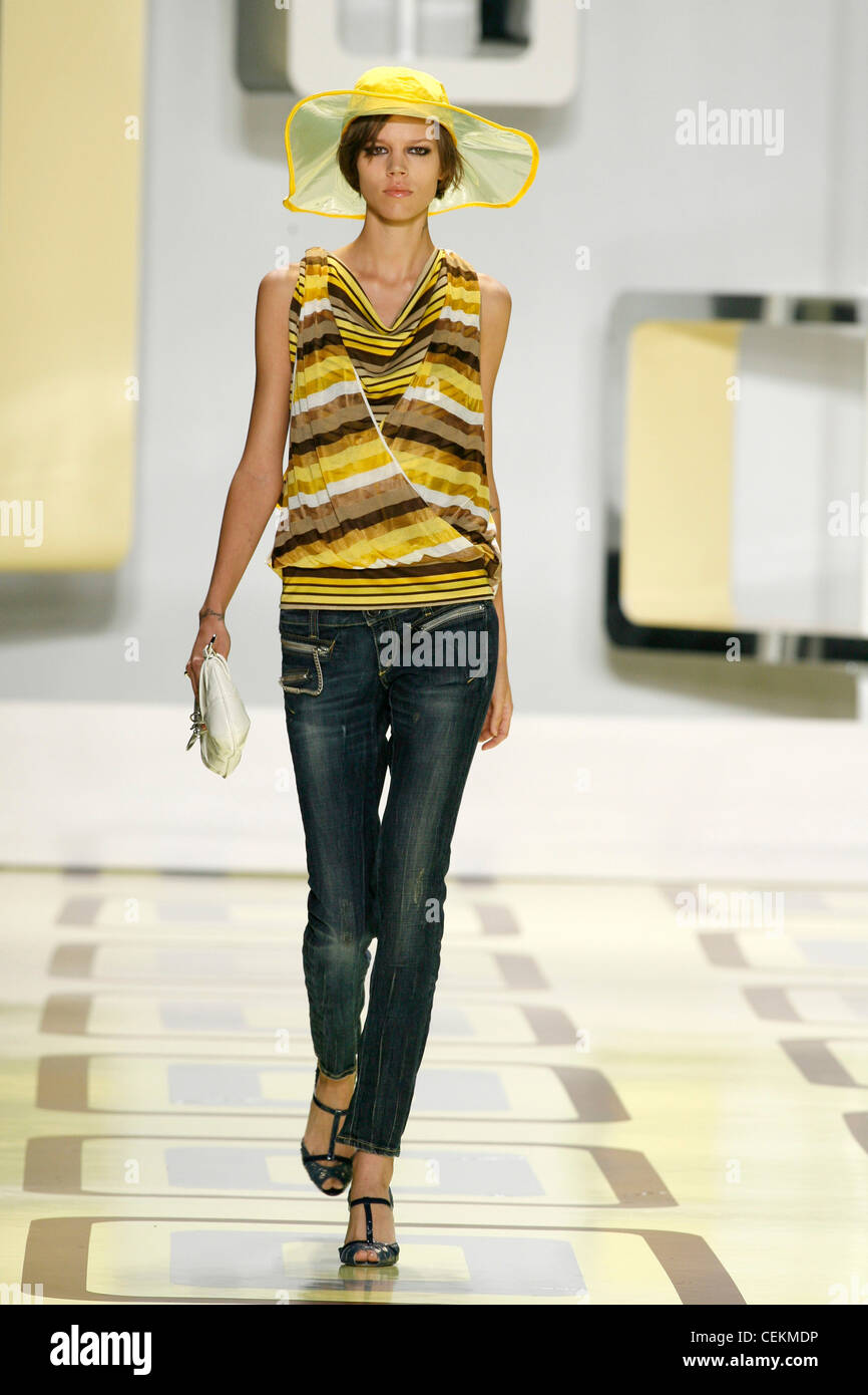 Miss Sixty New York Ready to Wear Spring Summer Yellow floppy hat,  sleeveless striped faux wrap yellow blouse, skinny jeans, t Stock Photo -  Alamy