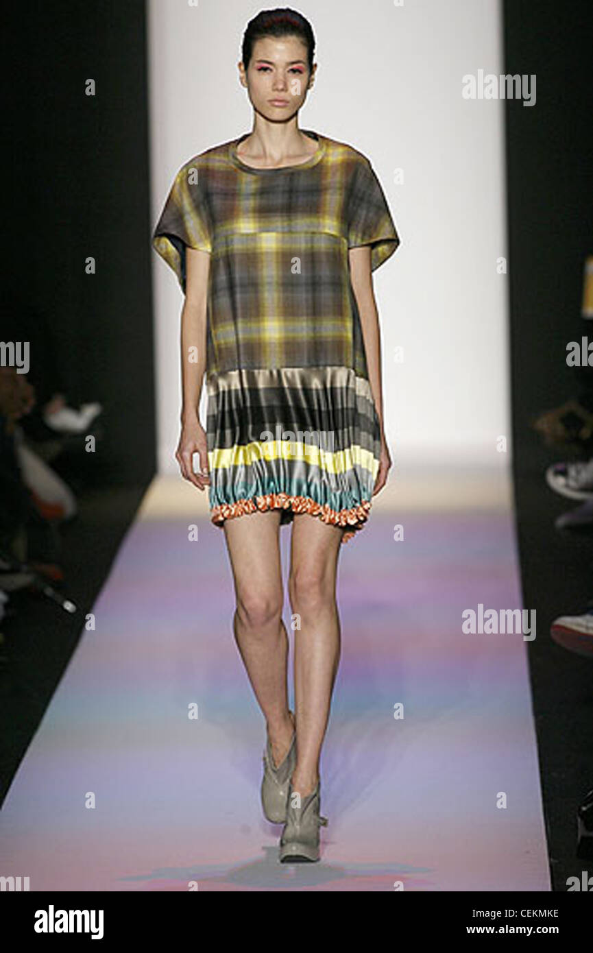 Alexandre Herchcovitch New York Ready to Wear Autumn Winter  Double fabric plaid sack dress with grey shoe boots Stock Photo