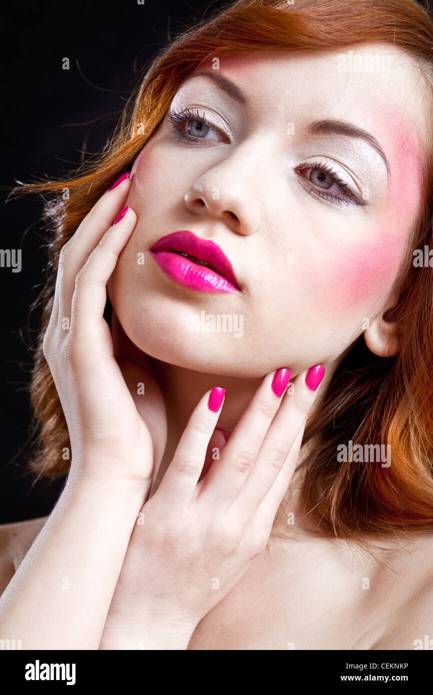 closeup of a girls face - pink lips and nails Stock Photo