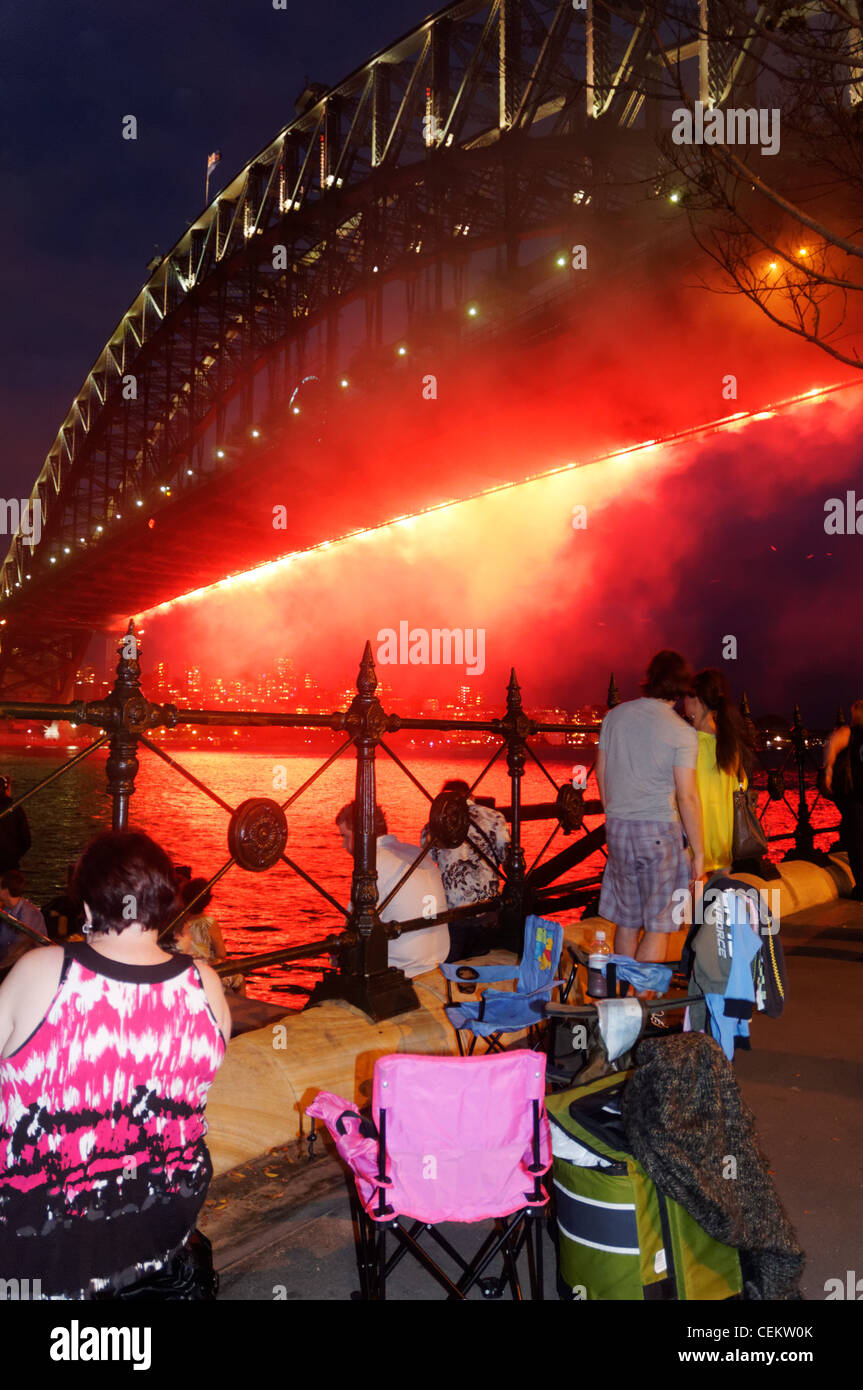 Crowds watching the fireworks from Sydney Harbour Bridge on New Year's Eve Stock Photo