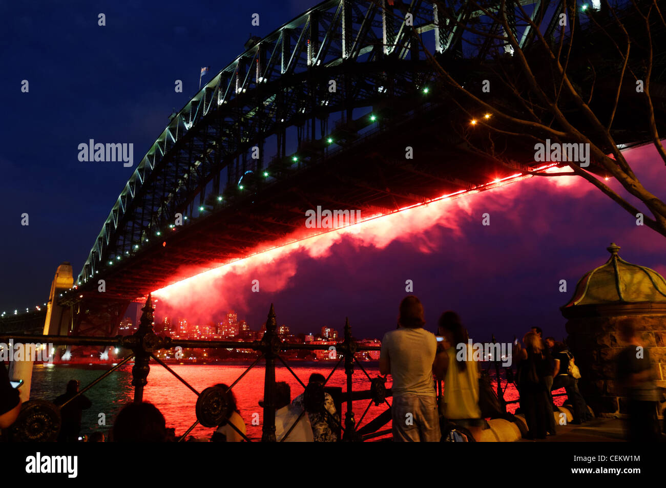 Crowds watching the fireworks from Sydney Harbour Bridge on New Year's Eve Stock Photo