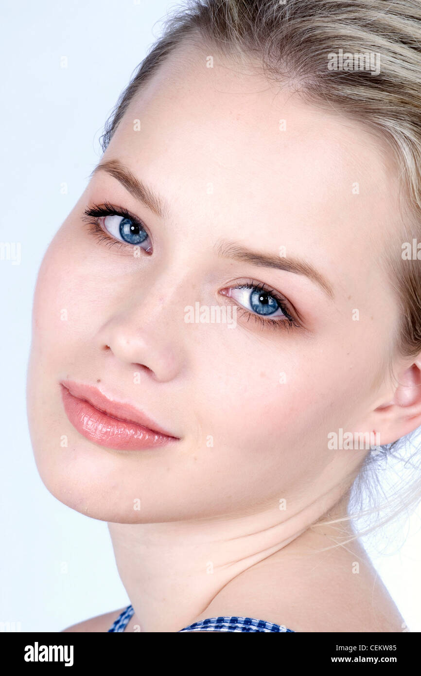 Female with soft brown eyeshadow, black mascara and soft pink glossy lips Stock Photo