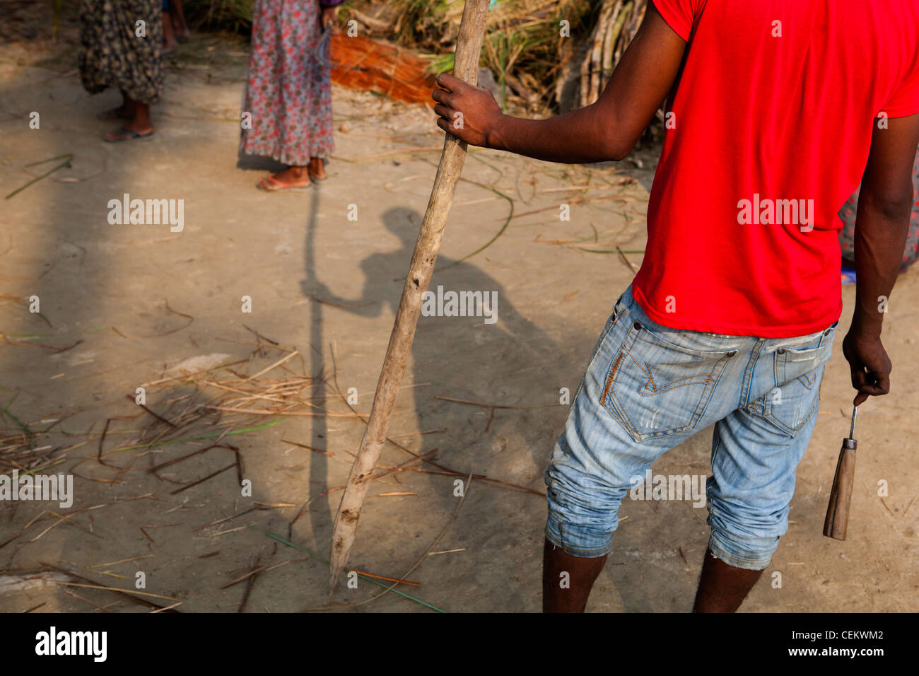 People crossing river grass cutting season Bardia national park Nepal Asia Stock Photo