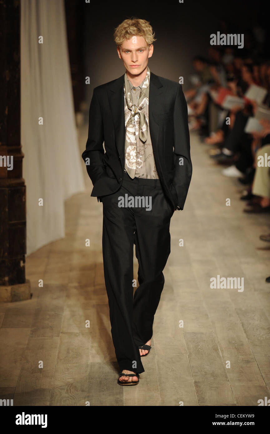 black suit beige shirt
