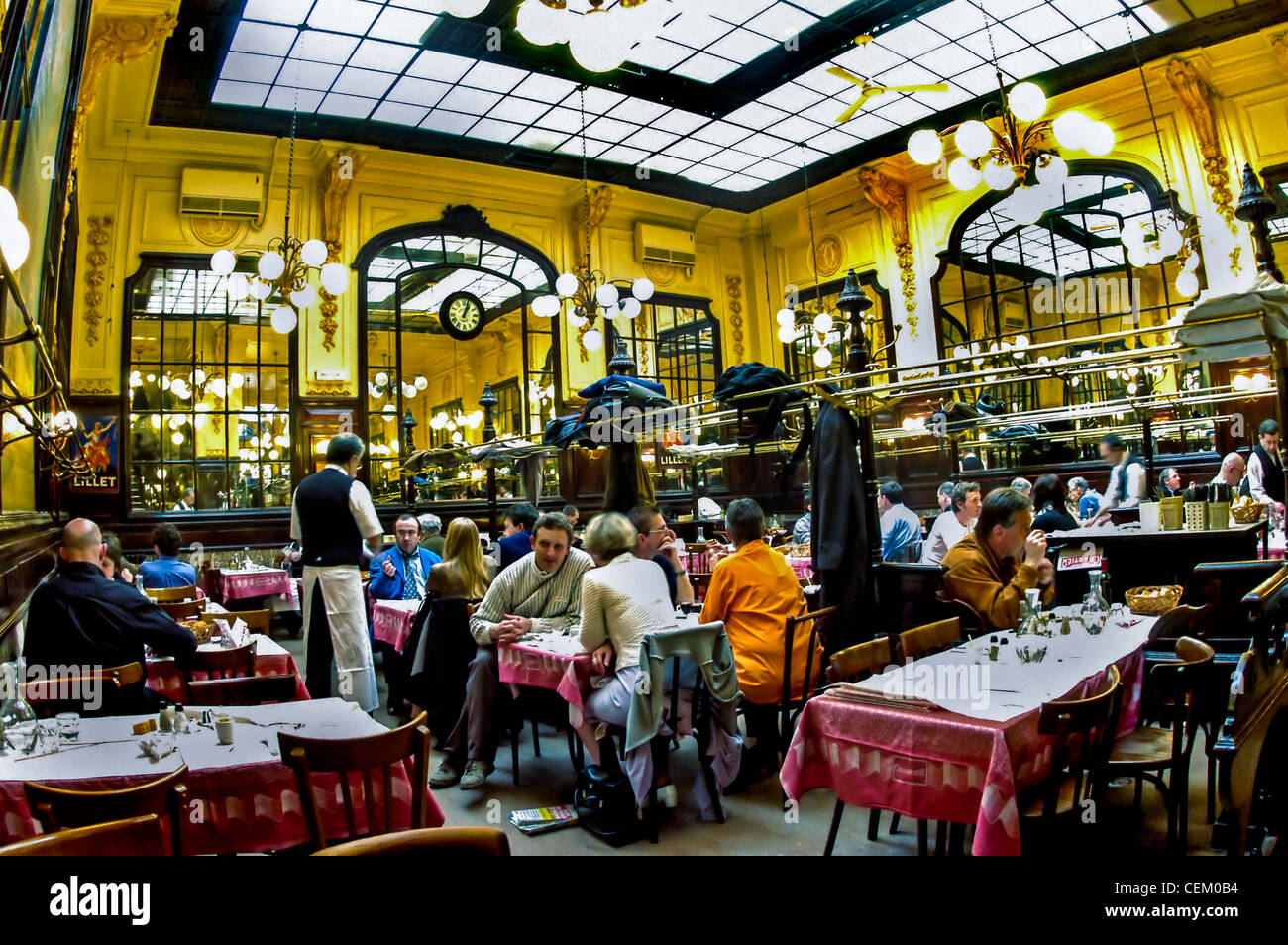 paris france people sharing meals inside chartier budget french