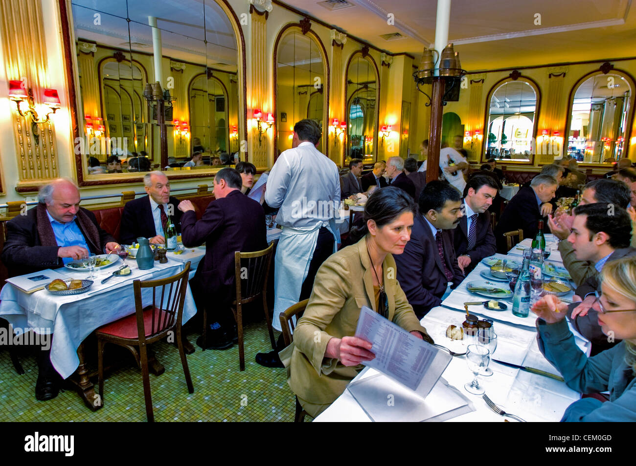 PARIS, France, Male Waiter inside French Bistro Restaurant. Serving Business Meal, Lunch at