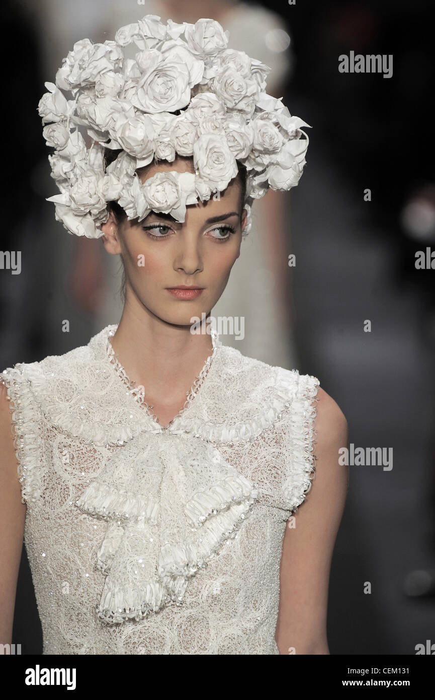 Chanel Paris Haute Couture Spring Summer Female with flower headdress,  wearing sleeveless lace outfit Stock Photo - Alamy