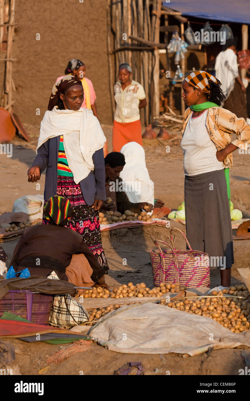 Women selling and buying vegetables. Wendogenet open air market. Hill resort. Ethiopia. Stock Photo