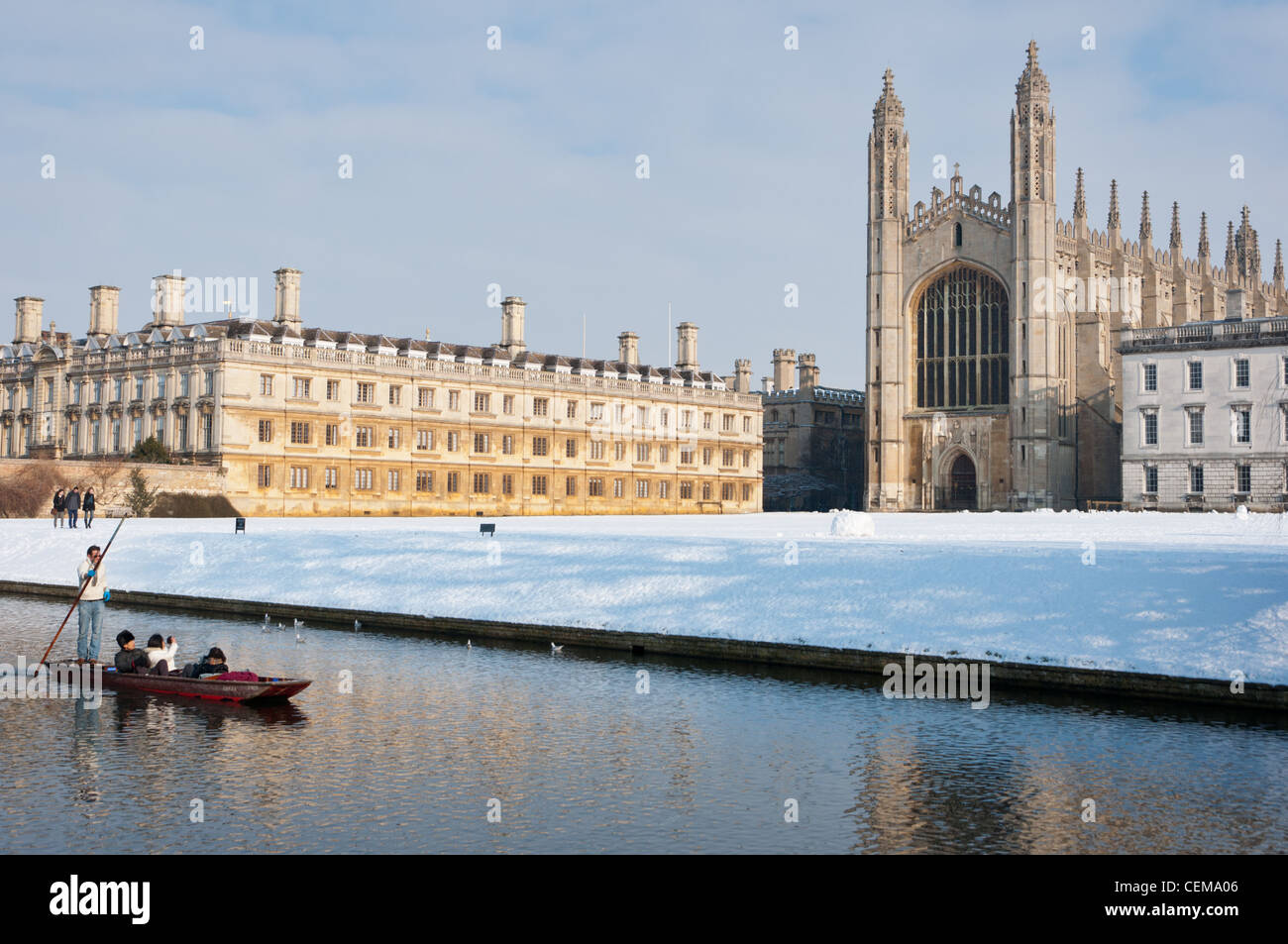 Punting along river Cam in winter snow with Kings College Chapel to the rear. Cambridge, England. Stock Photo