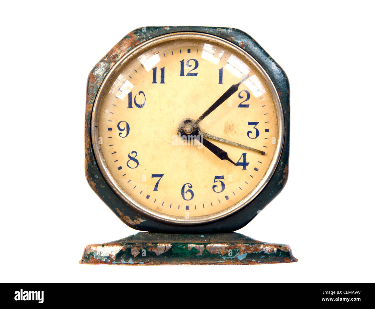 Ancient rusty metal clock. Vintage retro object isolated on white background. Stock Photo