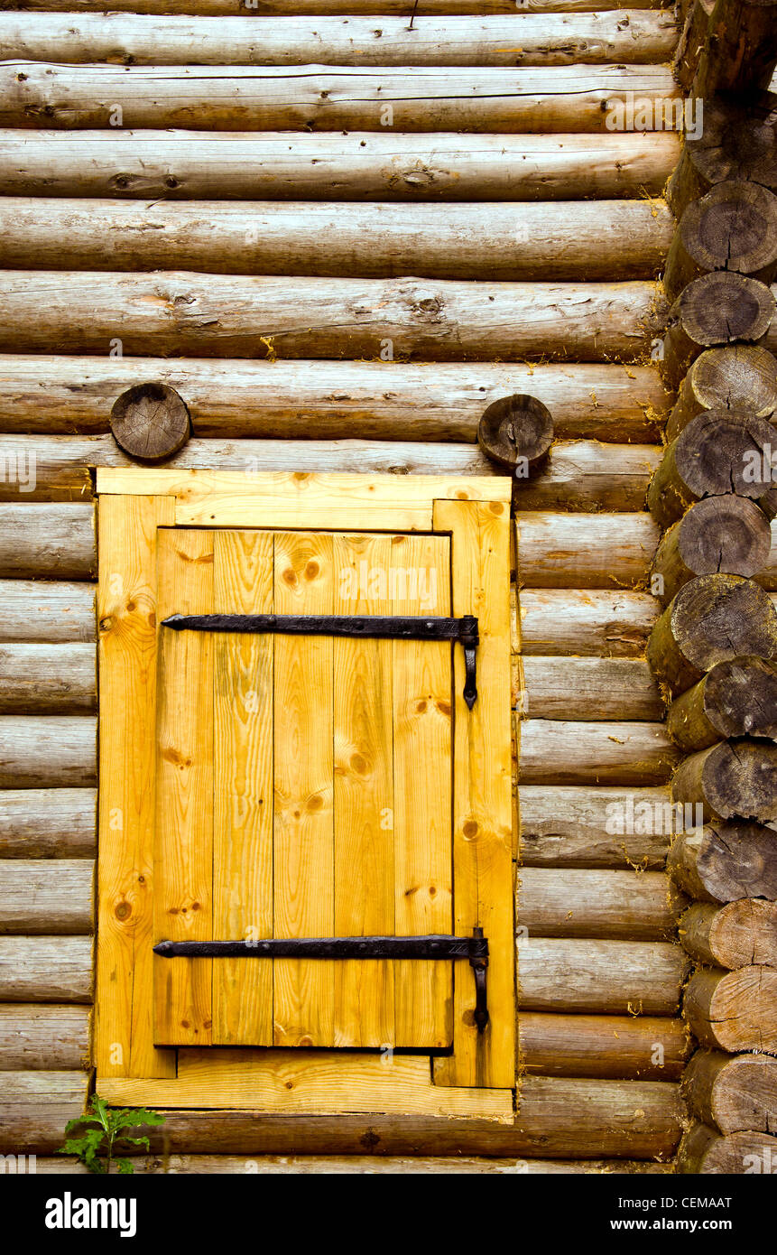 Old log house background and new wooden door of board set. Stock Photo