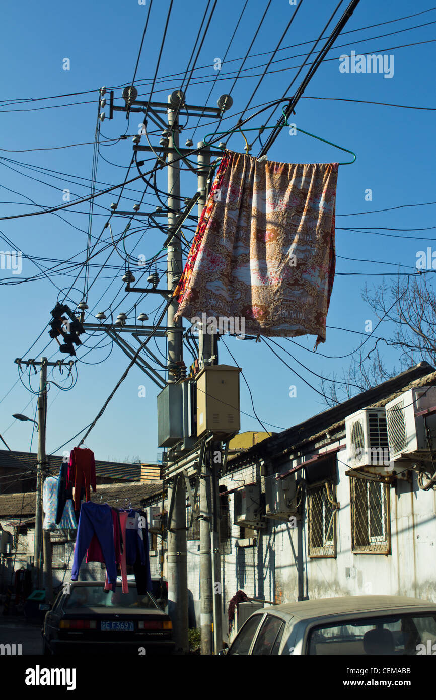 Clothes hanging on the wires Stock Photo - Alamy