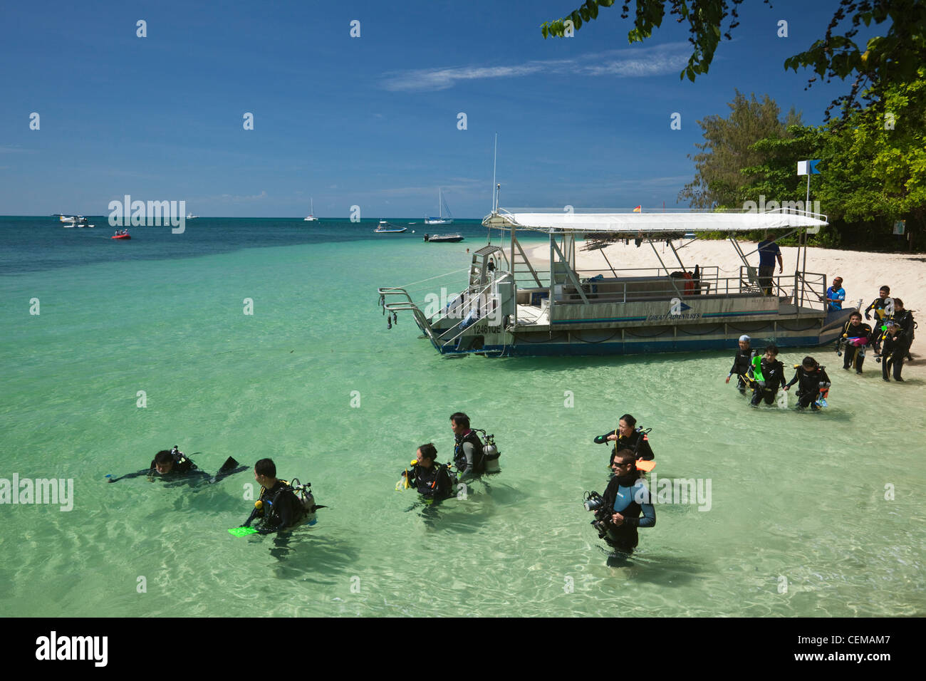 Scuba divers at Green Island - a coral cay off the coast of Cairns. Great Barrier Reef, Queensland, Australia Stock Photo