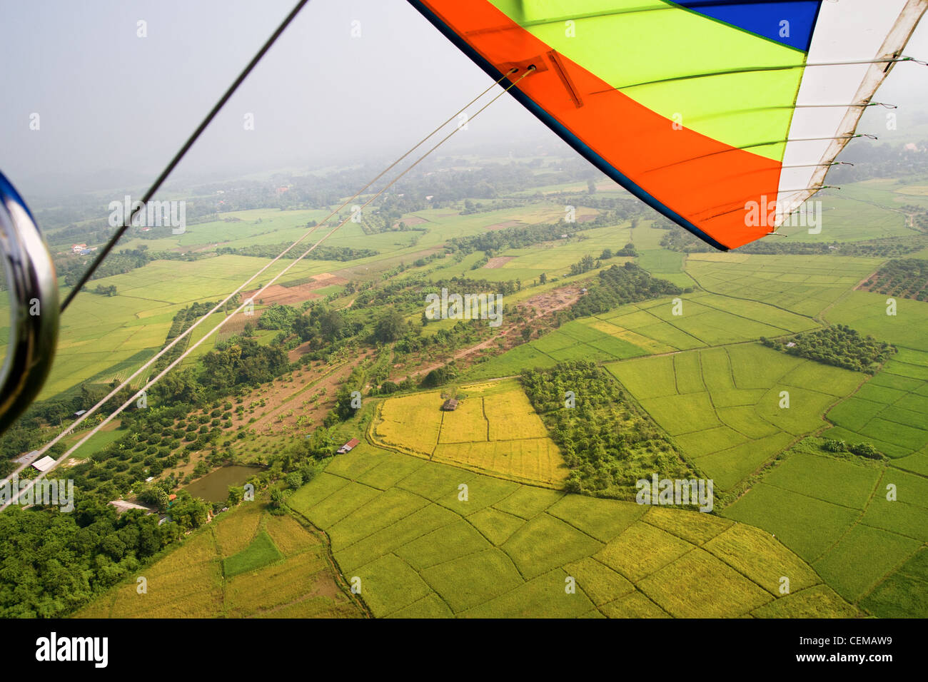 Aerial view from the hang glider over the green fields of Chiang Mai province in Northern Thailand Stock Photo