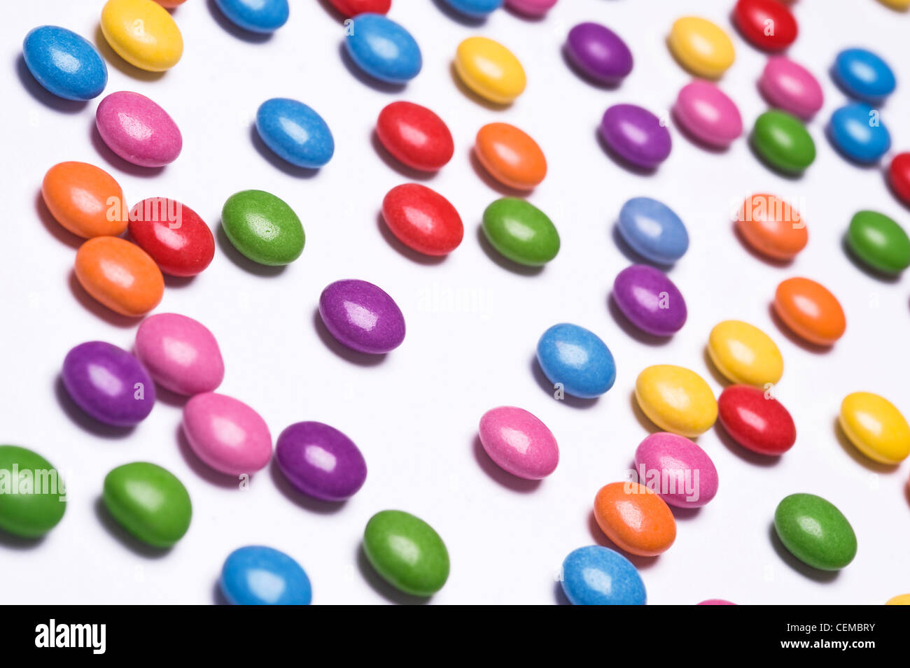 colorful pills scattered on white background Stock Photo