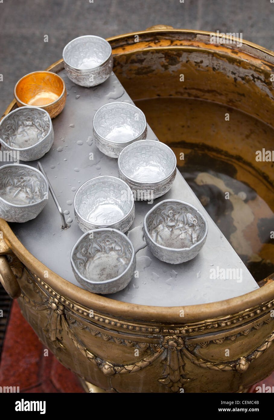 Holy water stoup at The Erawan Shrine Bangkok Stock Photo