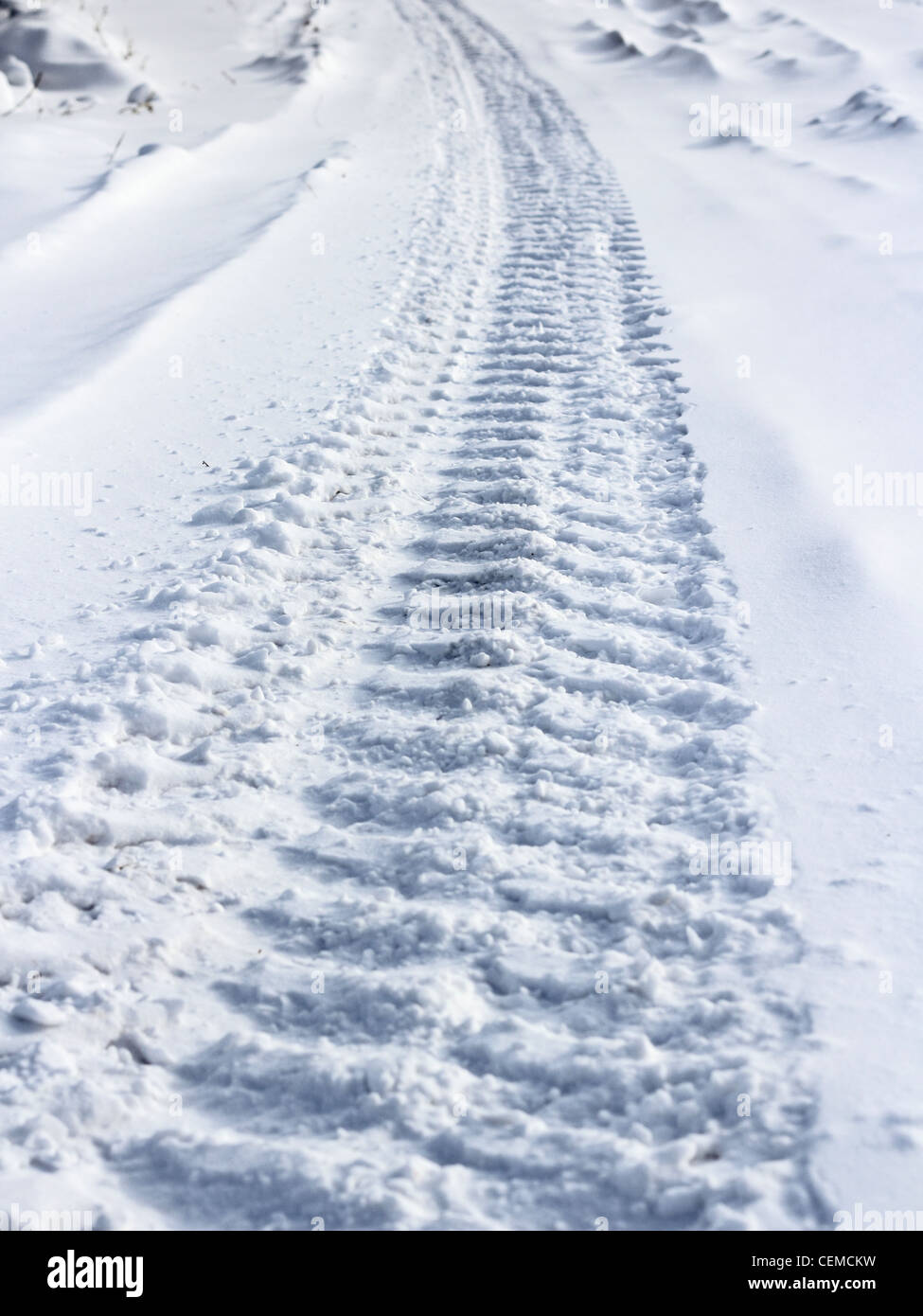 Traces from wheels of the car on snow Stock Photo - Alamy