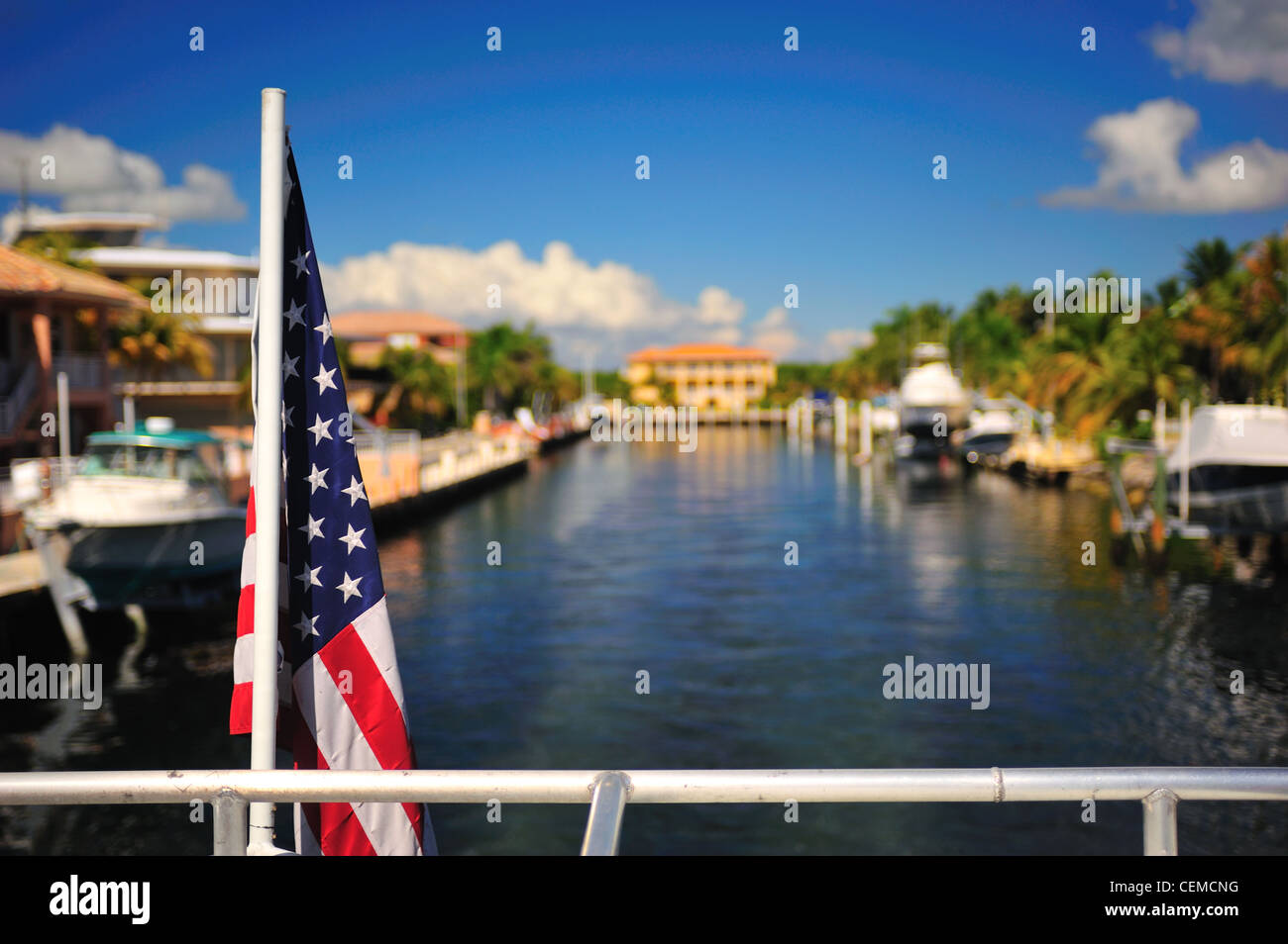 Photograph of the Stars and Stripes star spangled banner photographed against the backdrop of Key Largo, Florida Stock Photo