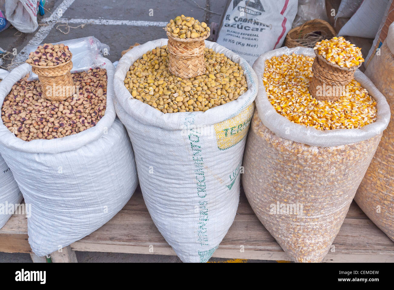 Open sacks of grains are on display for sale at the public market in ...