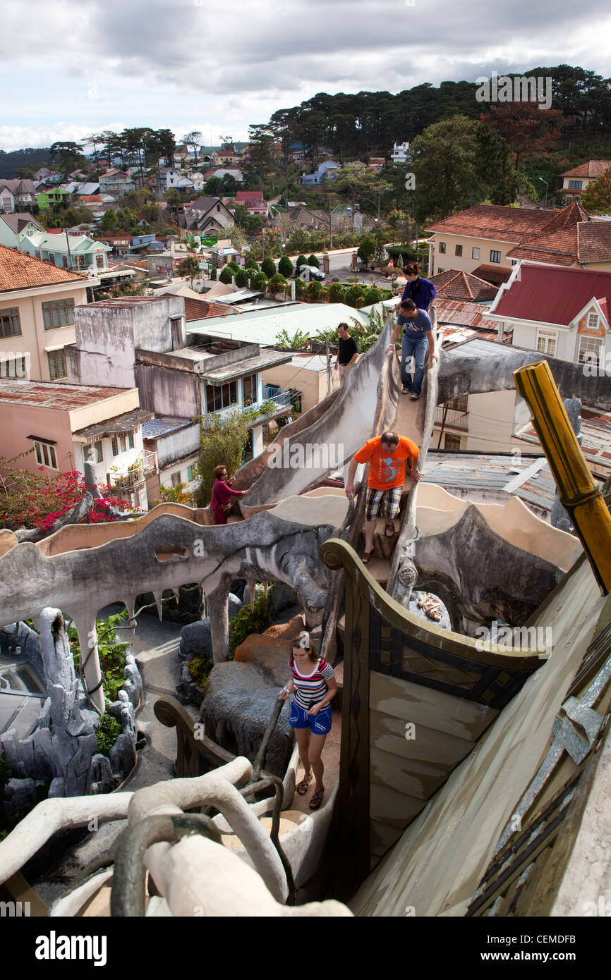 Tourists Climbing Roof Top Stairs at Hang Nga's Crazy House in Dalat Stock Photo