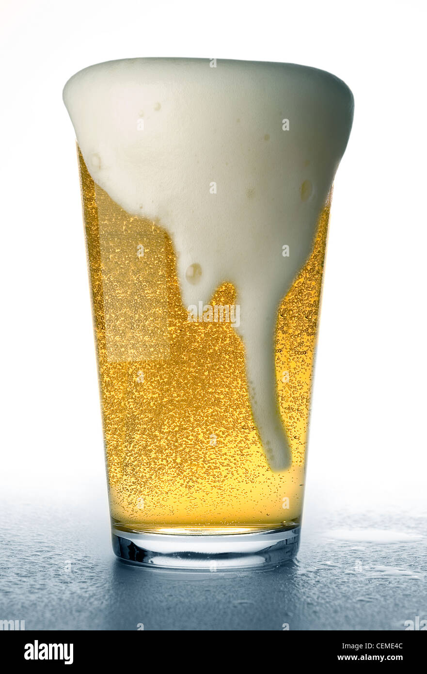 beer glass overflowing Stock Photo