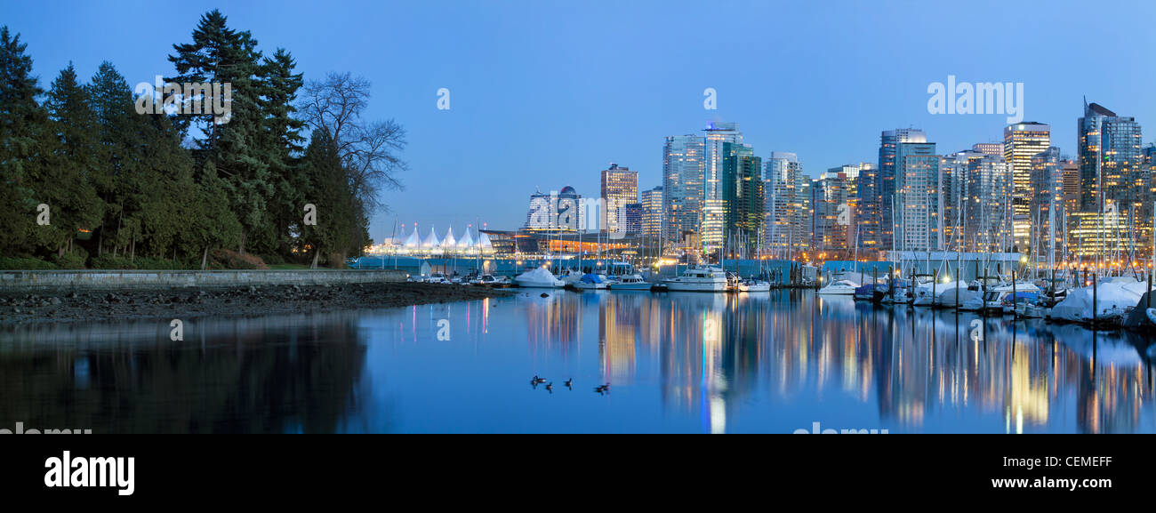 Vancouver BC Canada Skyline and Marina along False Creek from Stanley Park at Blue Hour Panorama Stock Photo