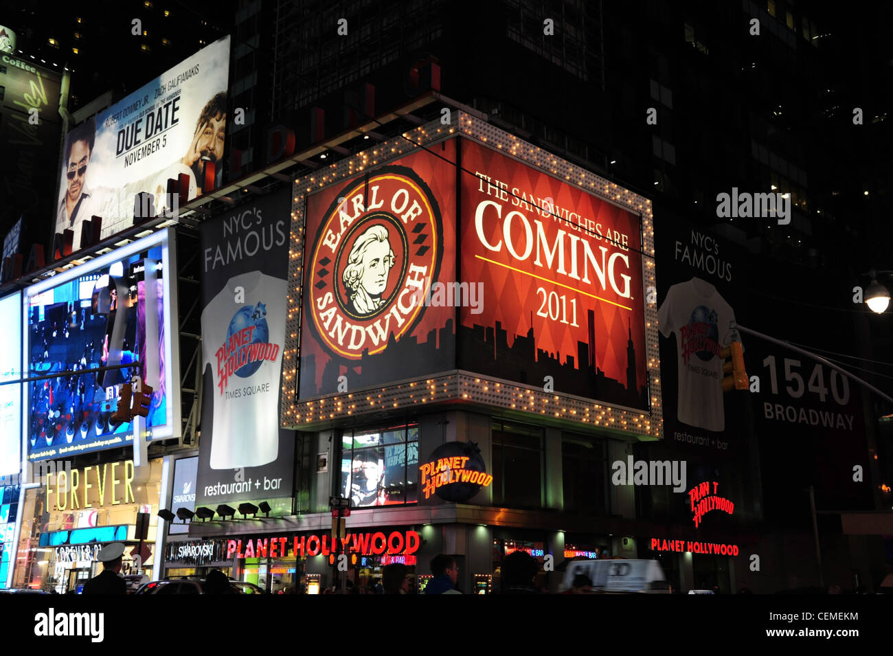 Night neon view Planet Hollywood Restaurant, Forever 21 Boutique Store, billboards, corner West 45th Street 7th Avenue, New York Stock Photo