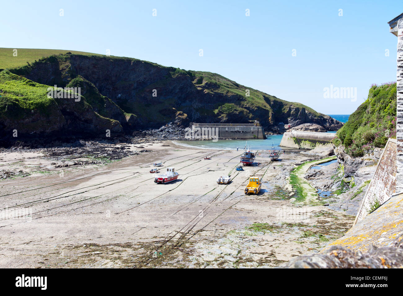 Port Isaac in Cornwall England, fishermen waiting for the tide to return Stock Photo