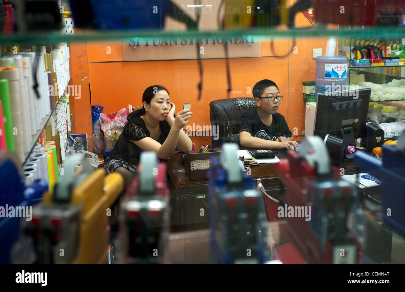 Chinese business woman and her son in Yiwu Market in Yiwu, Zhejiang province, China.05-Nov-2011 Stock Photo