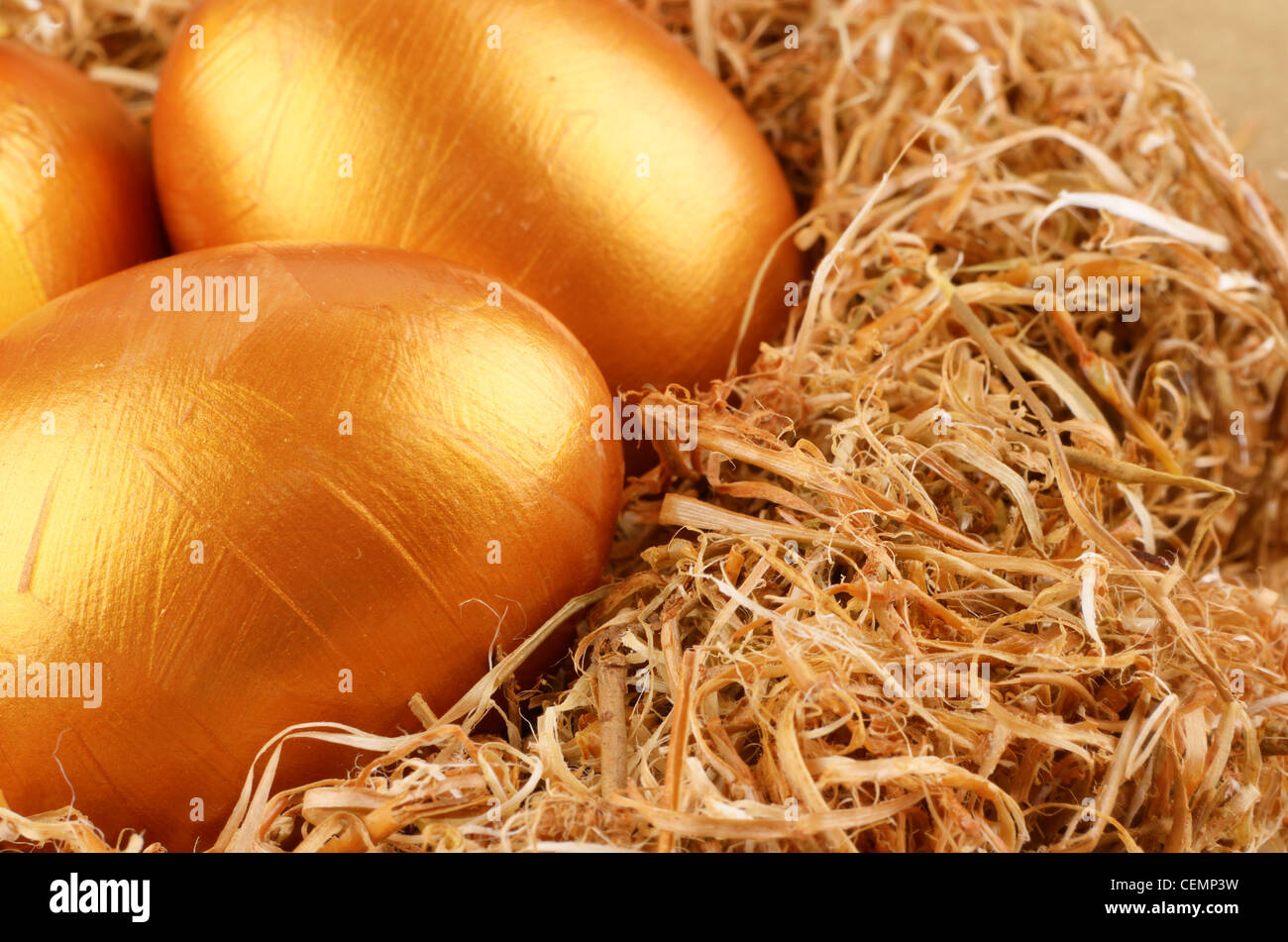 Golden Easter eggs in the nest over gold background Stock Photo - Alamy