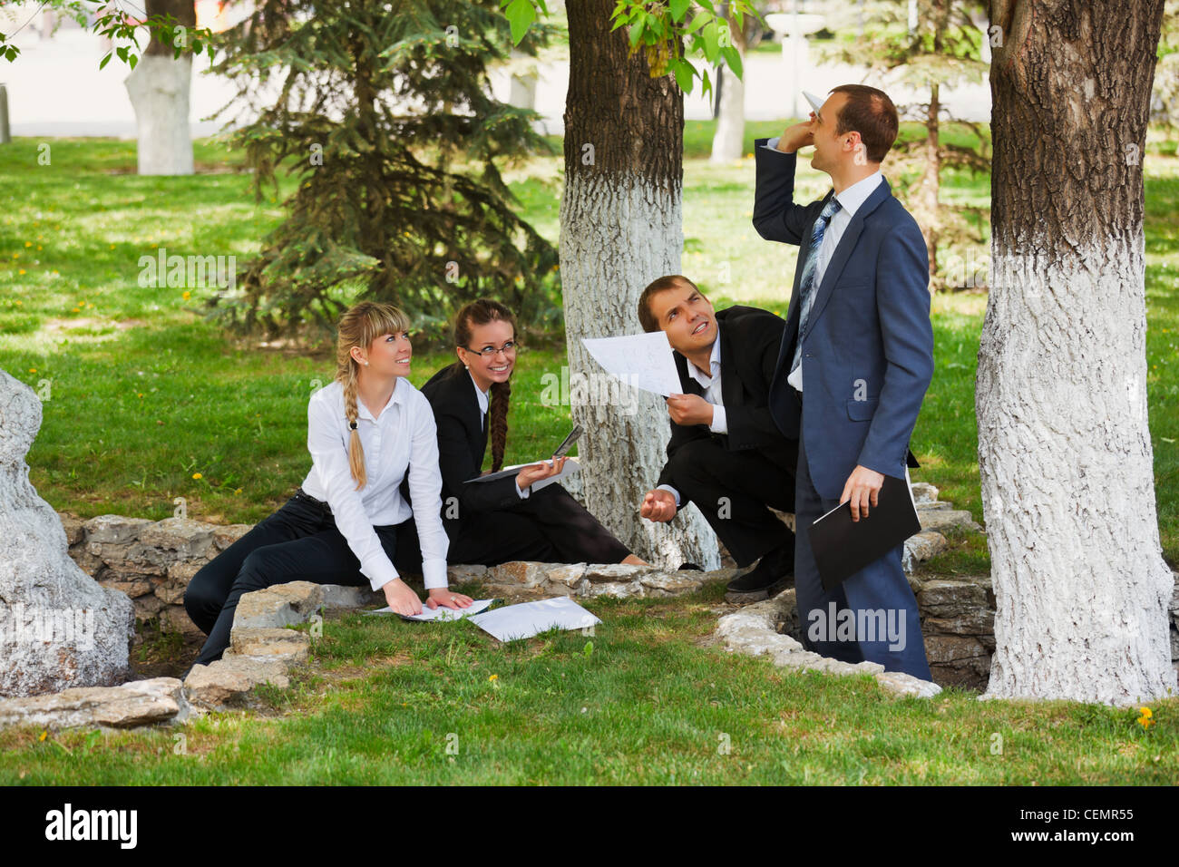 Young business people in a city park Stock Photo - Alamy