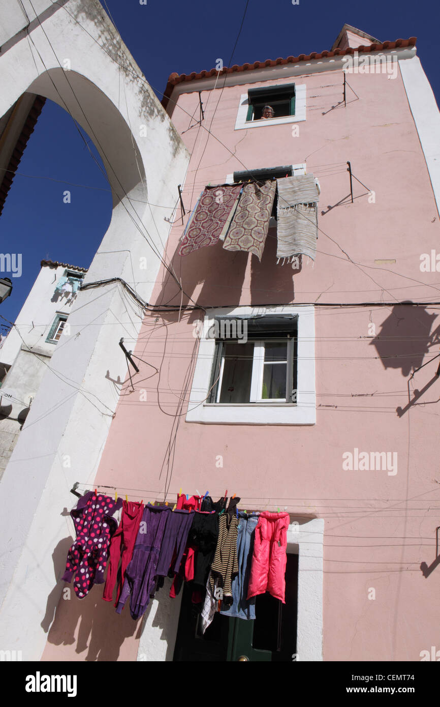 washing hanging outside of traditional townhouse, in central Lisbon Lisboa, Portugal Stock Photo