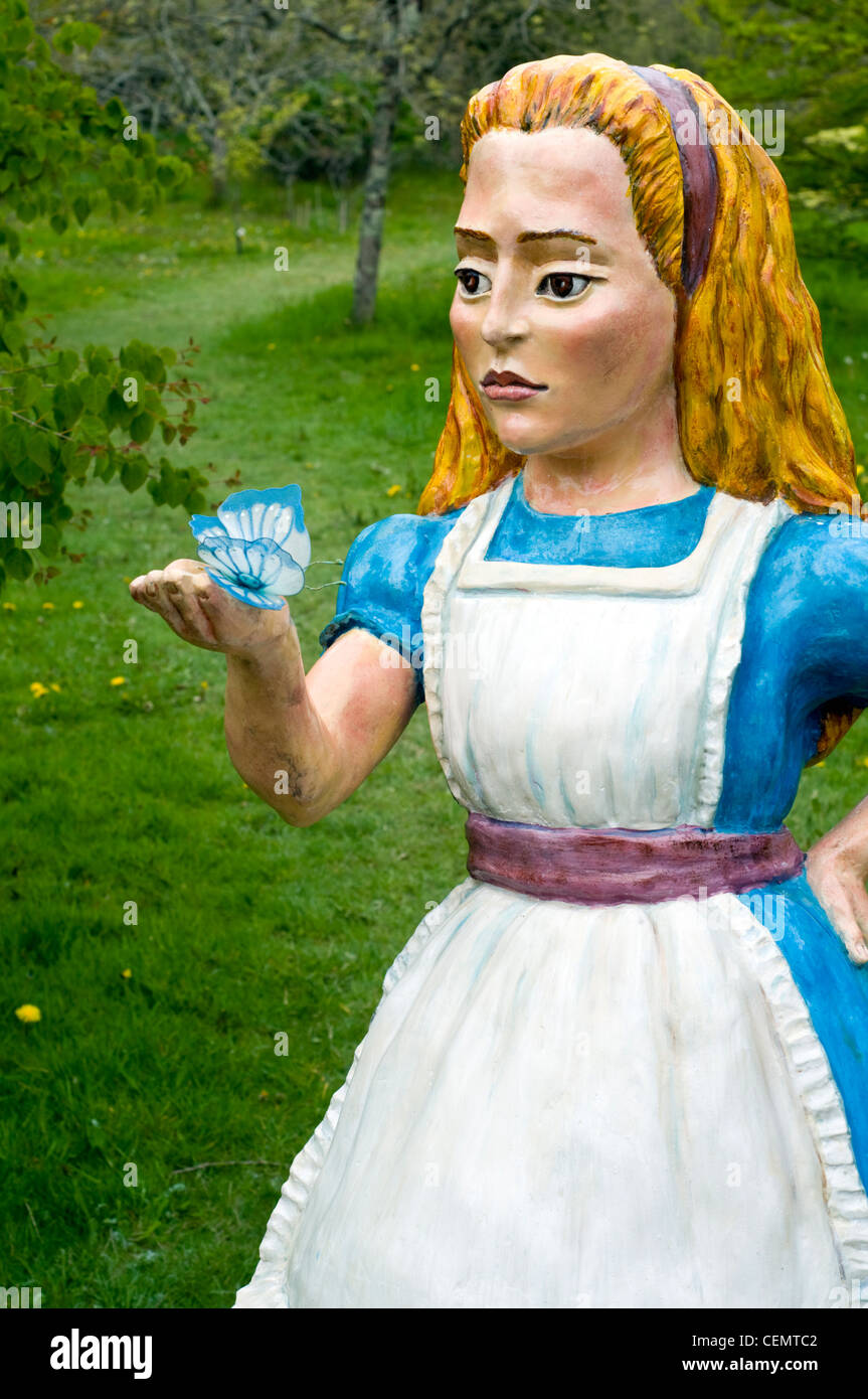 A statue of Alice in Wonderland in the gardens of the Antony estate in Cornwall, England, UK Stock Photo
