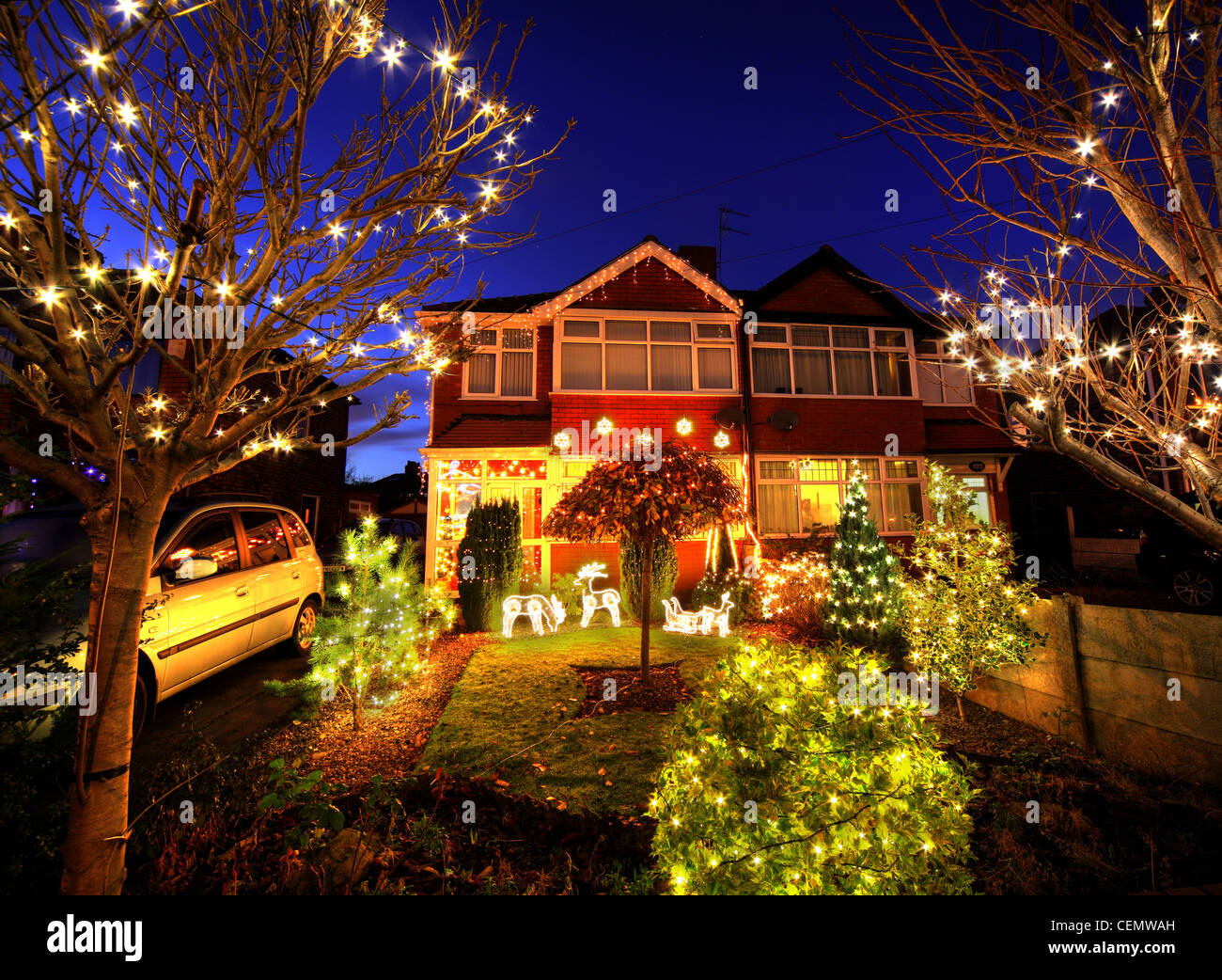 320 Padgate Lane Christmas lights Dusk, Warrington Cheshire England, UK super Xmas illuminations crazy interesting Stock Photo