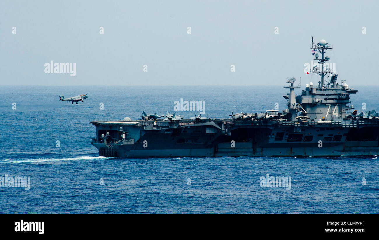 An EA-6B Prowler from the Wizards of Electronic Attack Squadron (VAQ) 133 makes its final approach to the Nimitz-class aircraft carrier USS John C. Stennis (CVN 74) after completing an air power demonstration practice. The John C. Stennis Carrier Strike Group is operating in the U.S. 3rd Fleet area of responsibility while on a seven-month deployment. Stock Photo