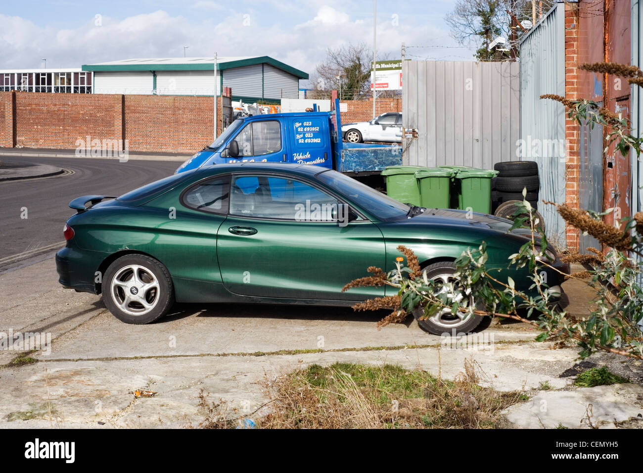 scrapped car waiting to be towed into scrapyard after failing mot Stock Photo Alamy