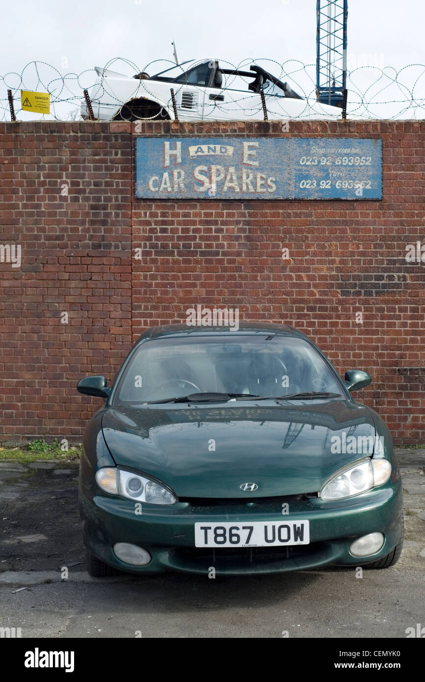 scrapped car waiting to be towed into scrapyard after failing mot Stock Photo Alamy