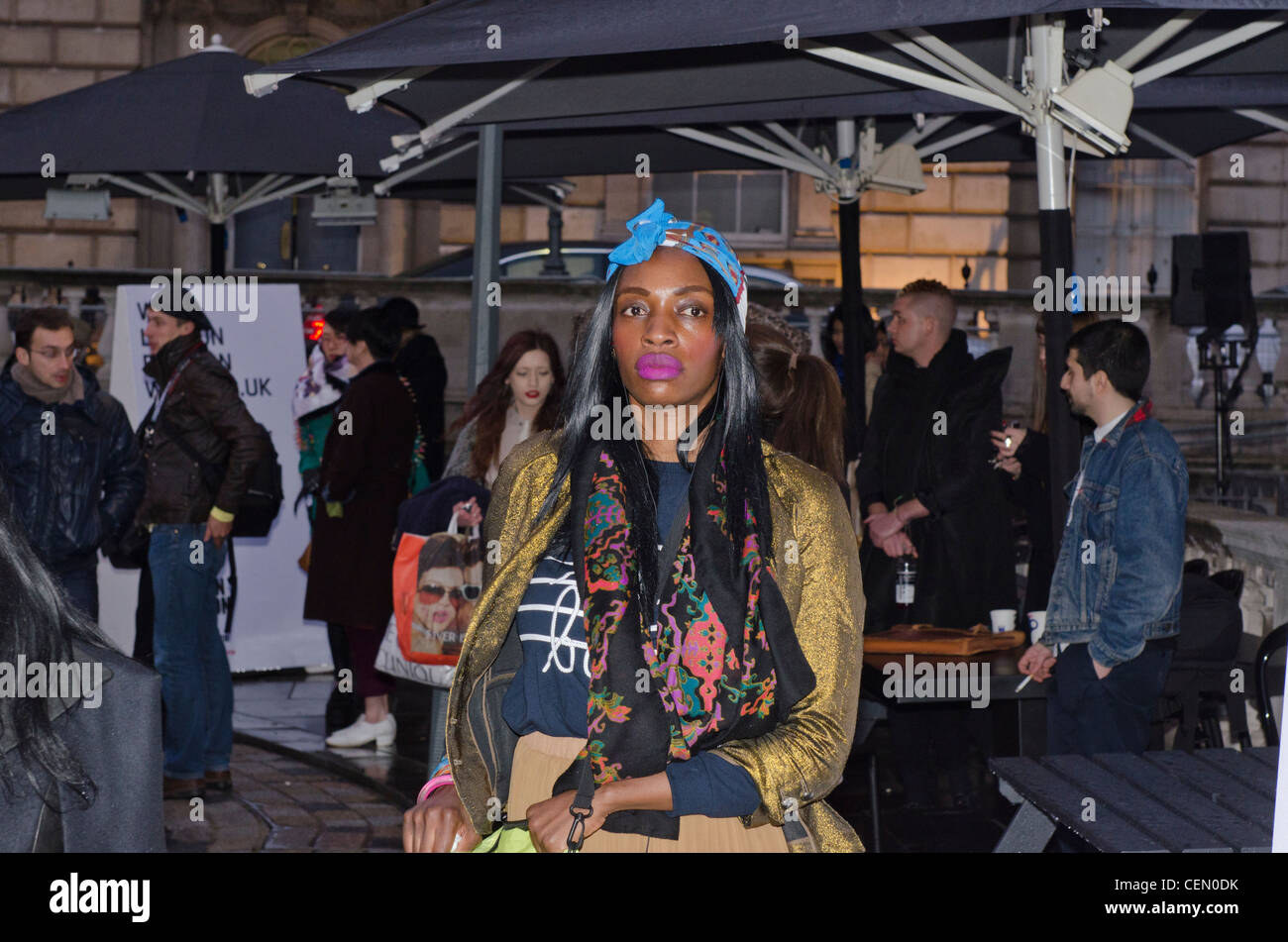 Black Woman in bright clothes London Fashion Week 2012 Stock Photo
