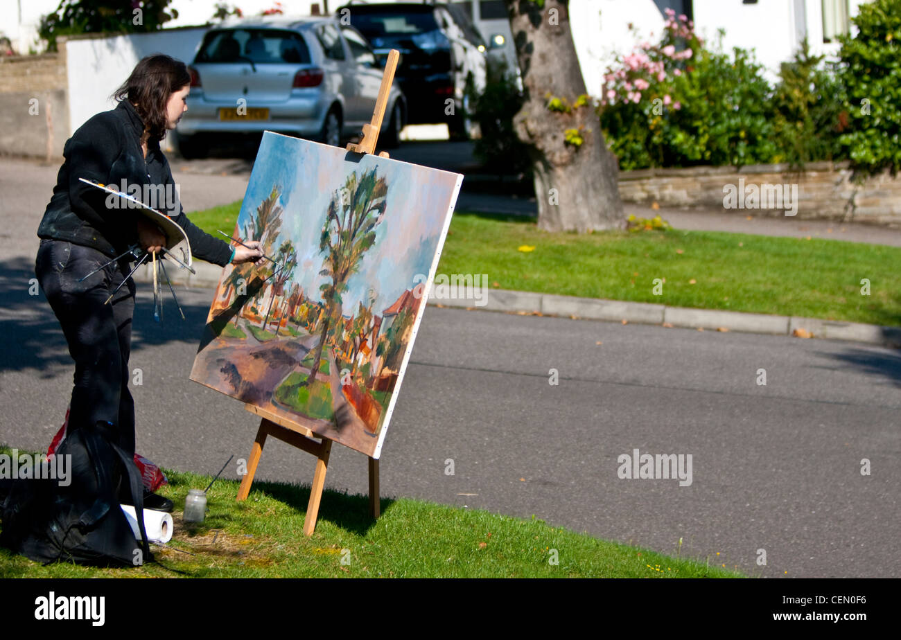 A female artist painting outdoors, Highgate, London, England, UK Stock