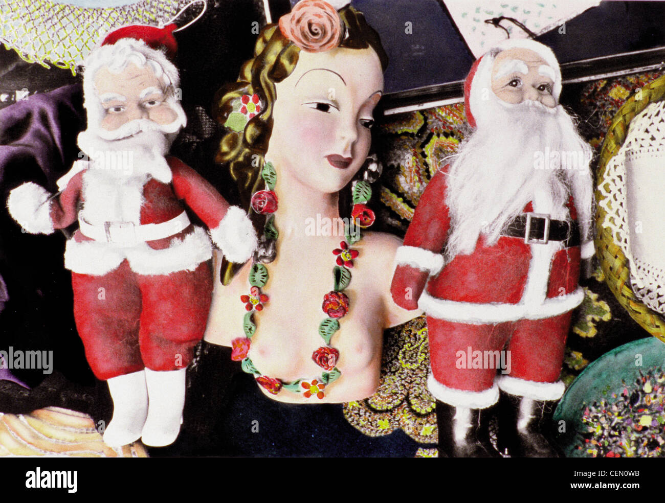 Hand colored photograph of ceramic wall decor, dolls and collectibles at street fair Still Santa Claus & Hula Female Stock Photo
