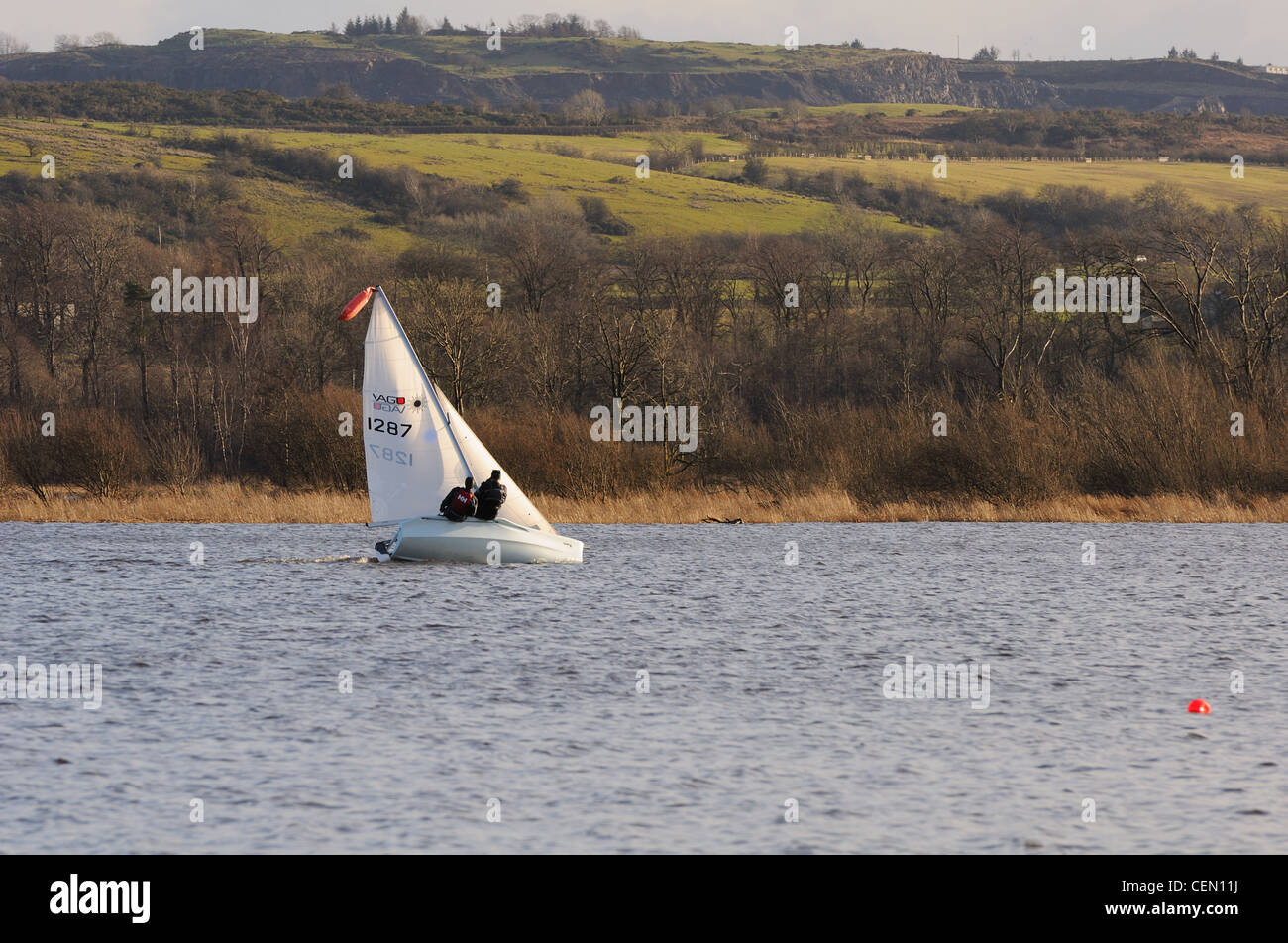 Learning to sail on Castle Semple Loch in some of Scotland's beautiful scenery as a backdrop. Stock Photo