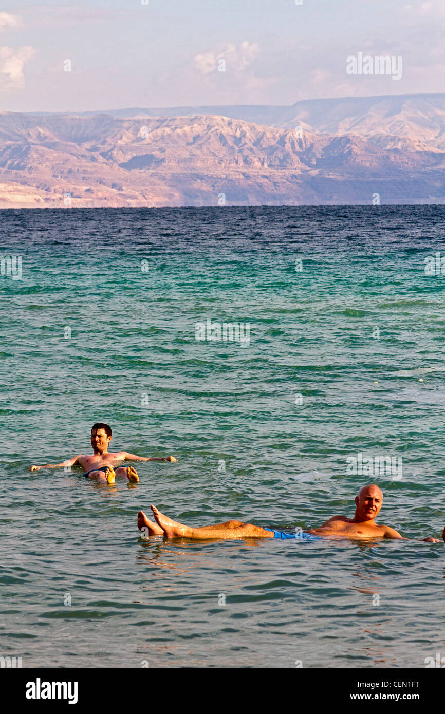 Bathers float in the super salty waters of the Dead Sea in Israel Stock Photo
