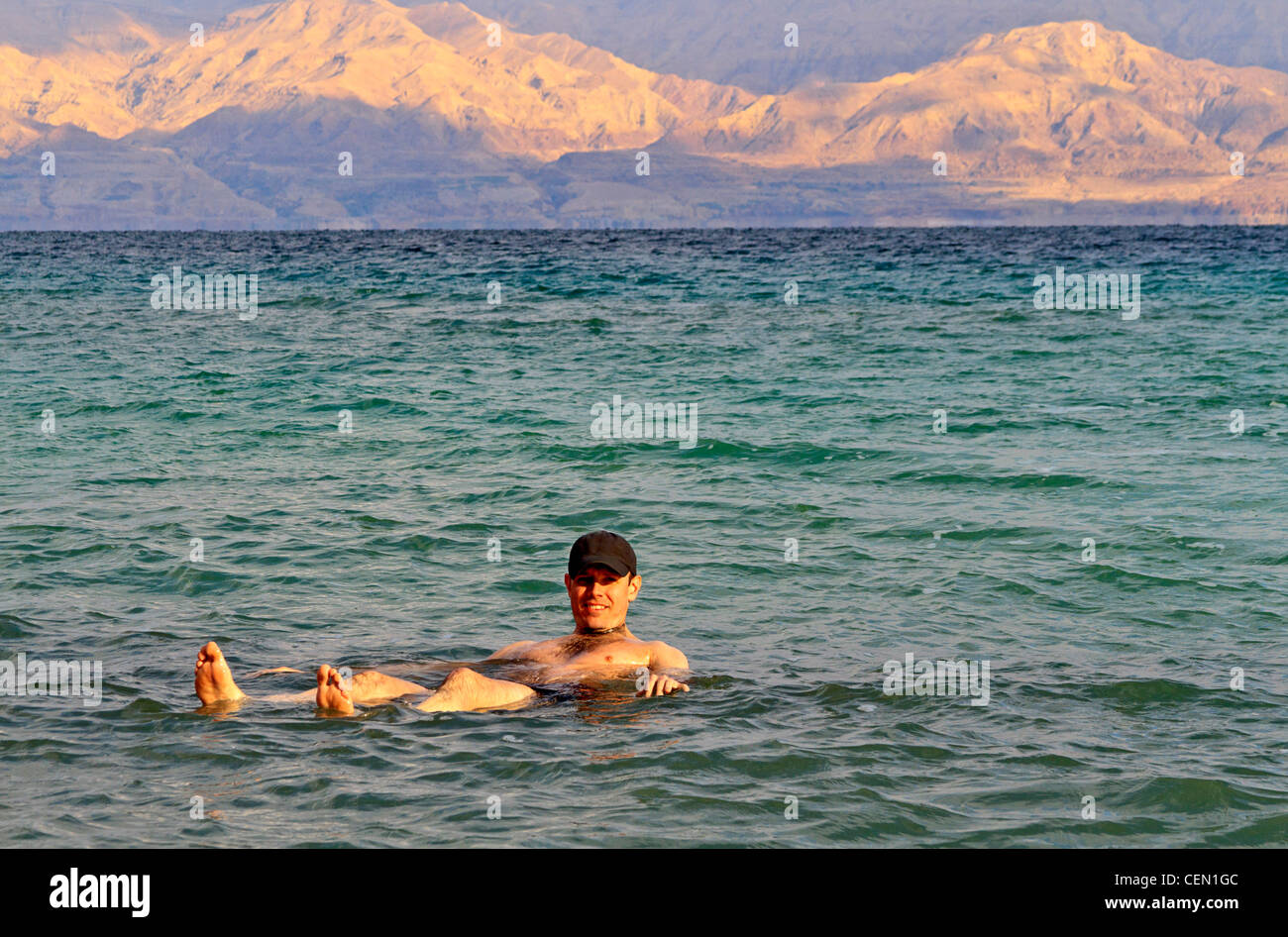 Bather floats in the super salty waters of the Dead Sea in Israel Stock Photo