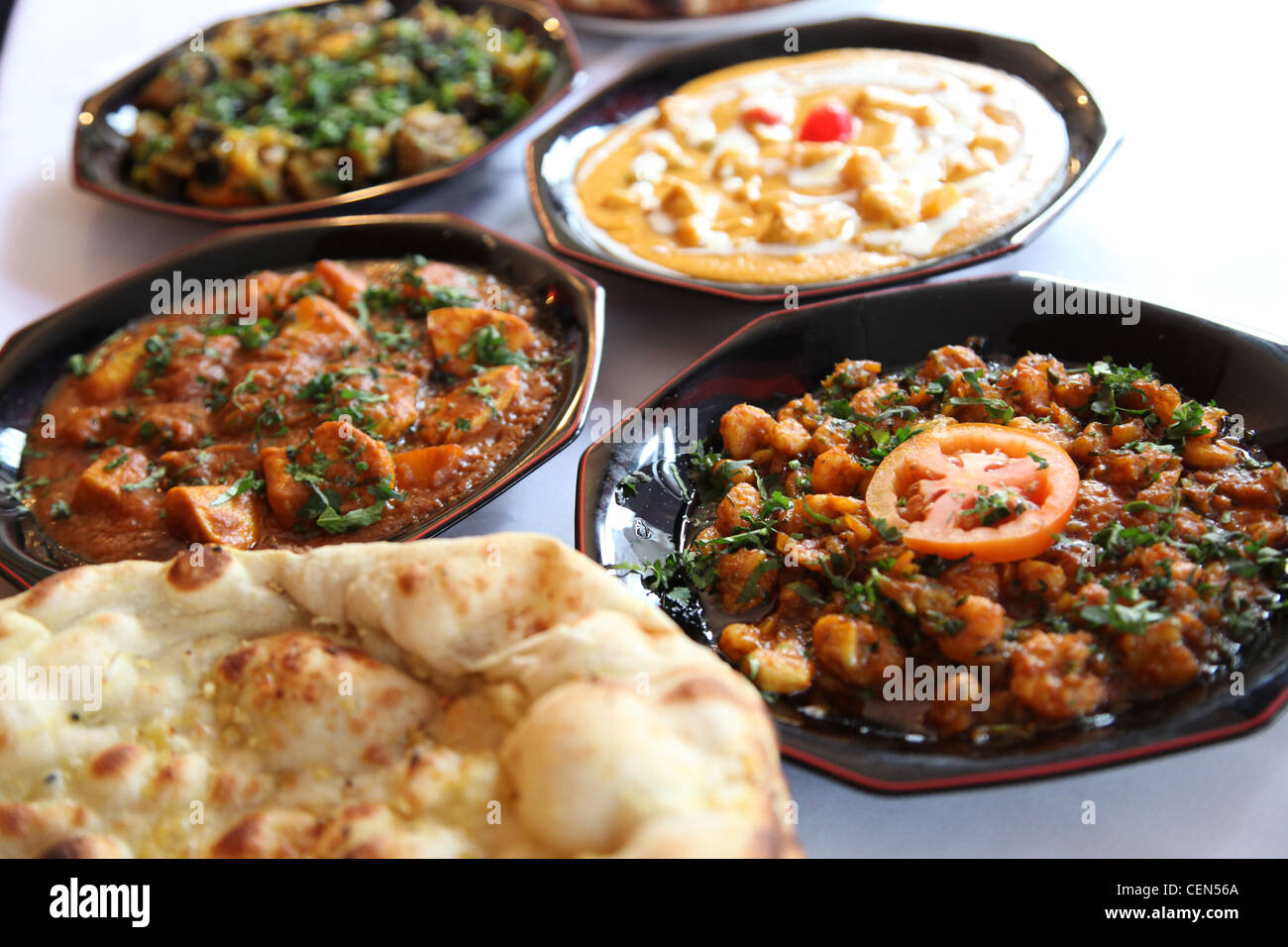 Dishes freshly prepared at an Indian restaurant in England Stock Photo